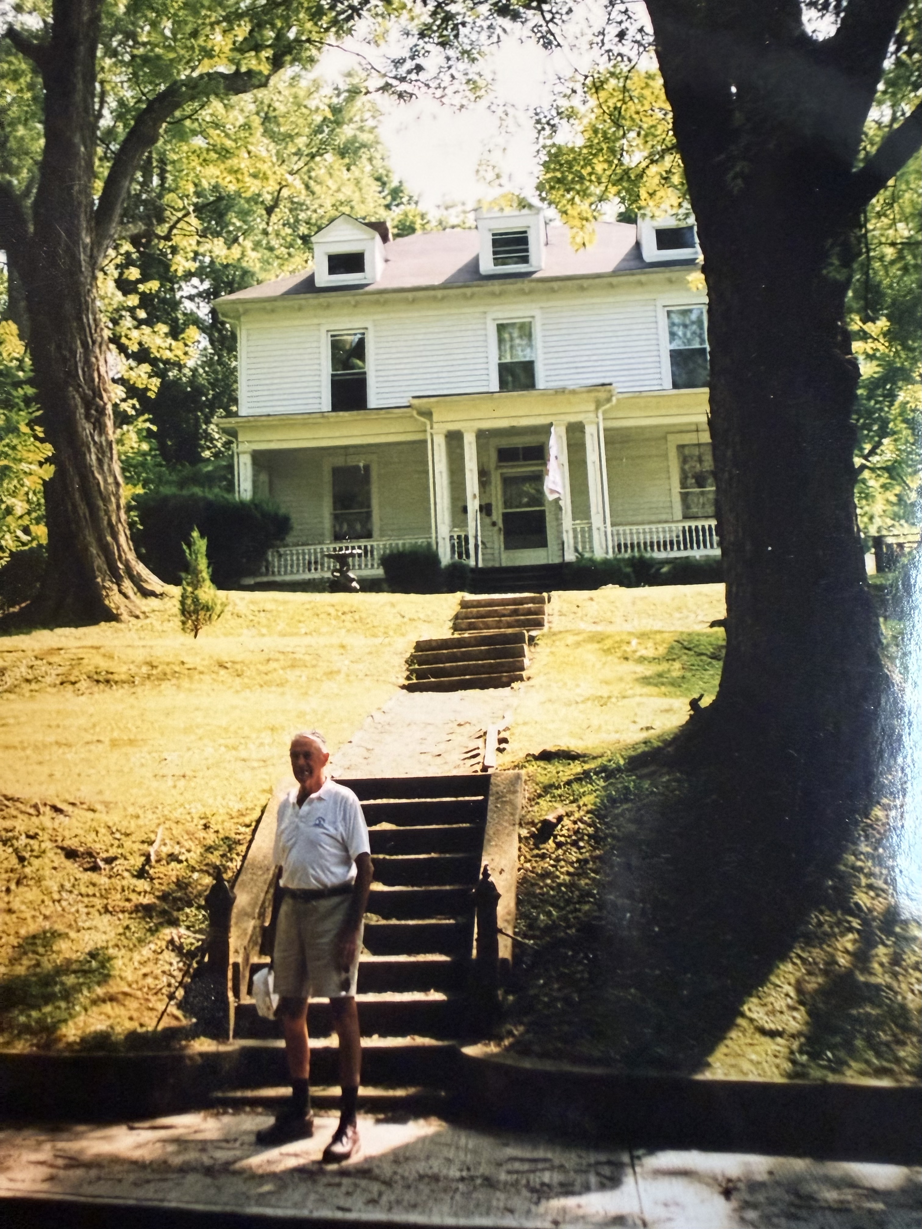 Barnes Gillespie standing before the Tazewell house where he was born